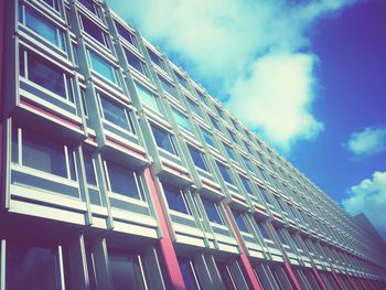 Low angle view of building against cloudy sky