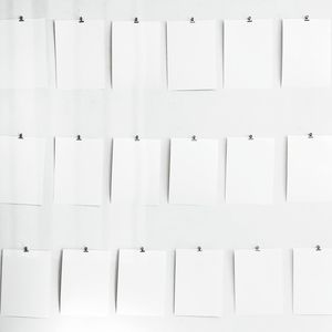 Empty notes on white wall