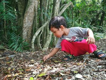Full length of boy in forest