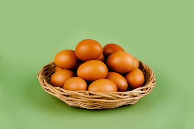 Close-up of apples in basket on table