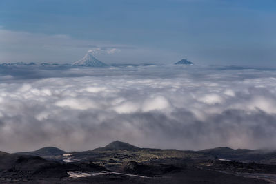 Scenic view of snowcapped mountains against sky