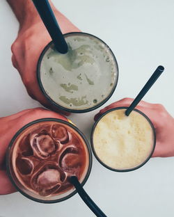 Close-up of hand holding drink
