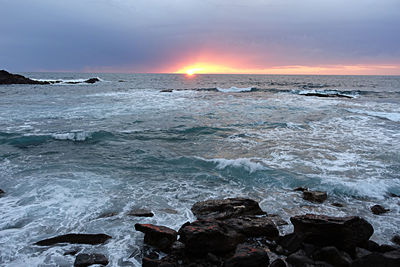 Scenic view of sea against dramatic sky