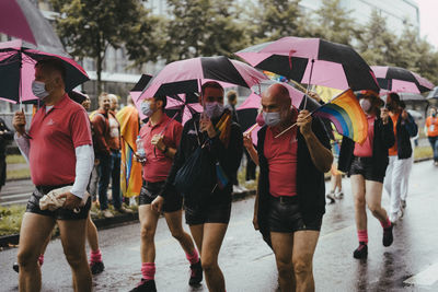 Group of people on wet rainy day