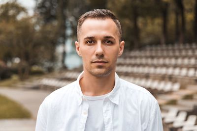 Portrait of young man standing outdoors