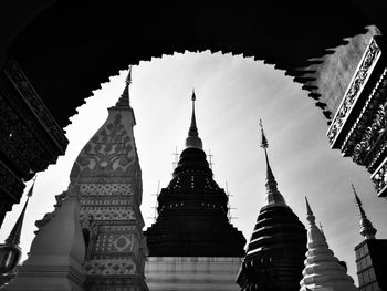 Low angle view of pagoda against buildings