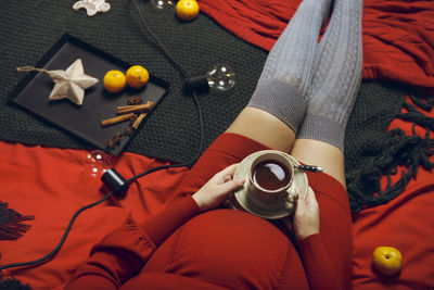 High angle view of woman hand with toys