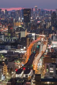 High angle view of illuminated cityscape at night