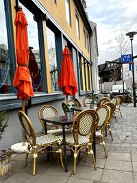 Empty chairs and tables in restaurant