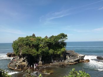 Scenic view of sea against sky at tanah lot bali
