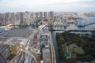 High angle view of river amidst buildings in city