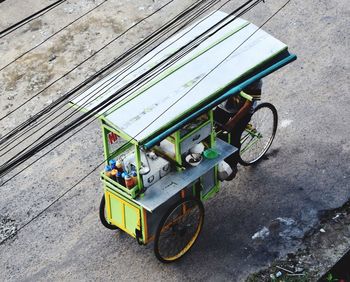High angle view of pedicab food cart on street