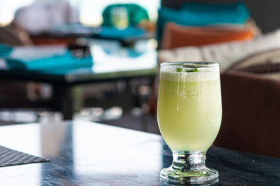 Close-up of beer glass on table