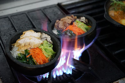 High angle view of fresh food in container on stove