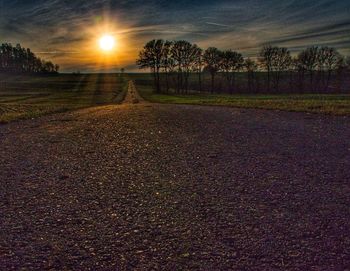 Scenic view of field against sky during sunset