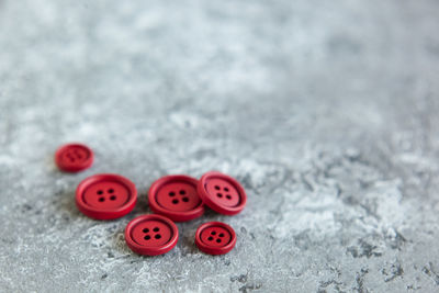 High angle view of buttons on snow