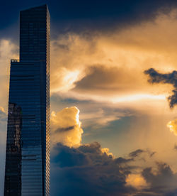 Low angle view of buildings against sky during sunset