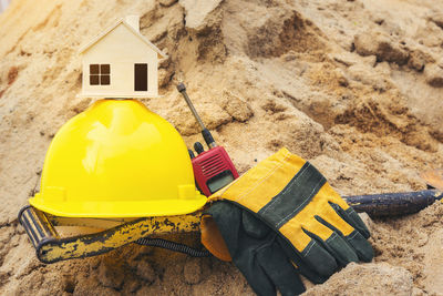 Yellow hat on sand at construction site