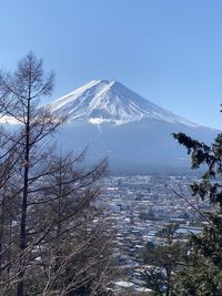 Scenic view of snowcapped mountains against clear sky