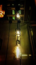 Low angle view of illuminated light bulb