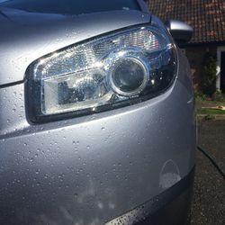 Close-up of car on road