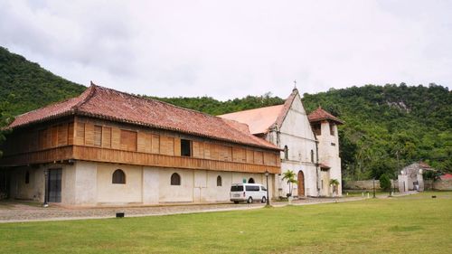 House on field against sky