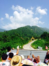 People relaxing on mountain