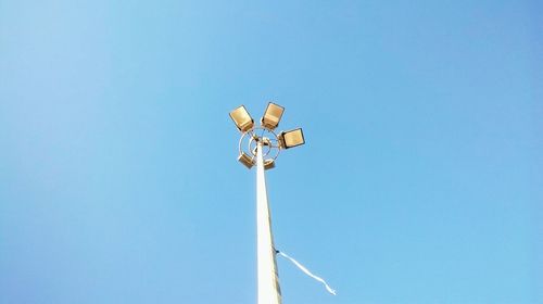 Low angle view of street light against clear blue sky