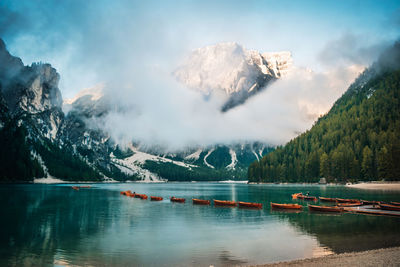 Scenic view of lake and mountains against sky