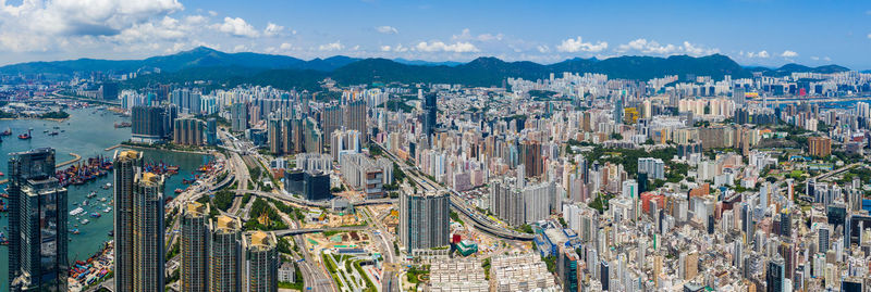 High angle view of modern buildings in city against sky