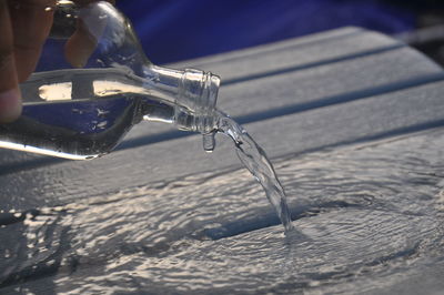 Close-up of faucet in water