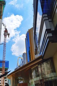 Low angle view of modern building against sky in city