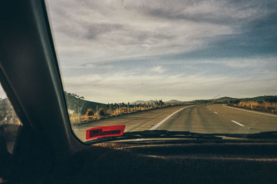 Road seen through car windshield