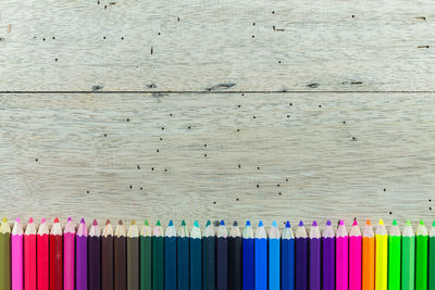 Directly above shot of multi colored pencils on table