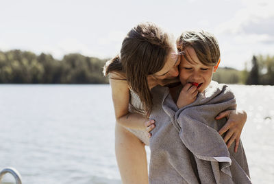 Mother with son at lake