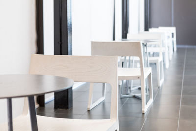 Empty chairs and table in restaurant