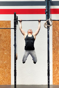 Young woman exercising at gym