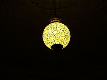 Low angle view of lit lamp