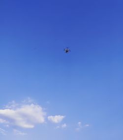 Low angle view of airplane flying in sky