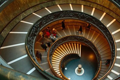 High angle view of people on spiral staircase