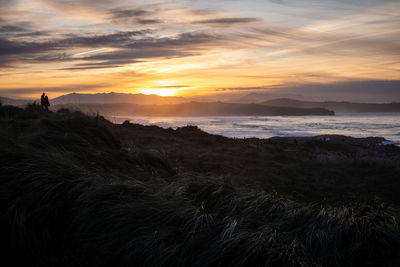Scenic view of sea against sky during sunset