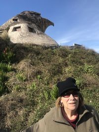 Portrait of smiling young woman against plants