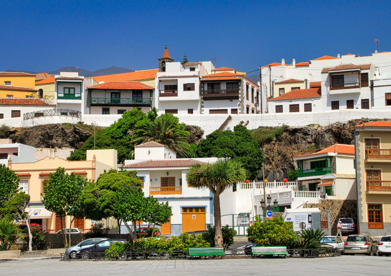 BUILDINGS AGAINST BLUE SKY