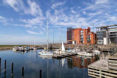 Boats moored at harbor