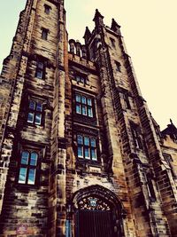 Low angle view of old building against sky