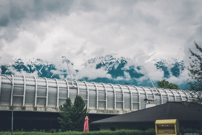 Panoramic view of building and trees against sky