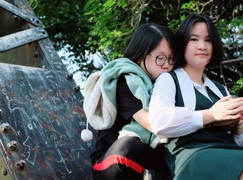 Portrait of mother and daughter while standing outdoors