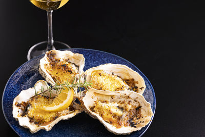 Close-up of food on table against black background