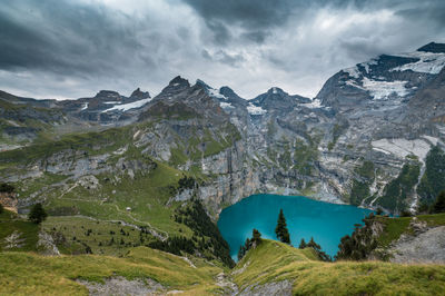 Scenic view of lake and mountains against sky