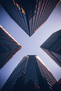 Low angle view of modern buildings against clear sky